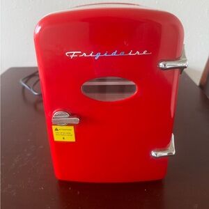 Mini fridge! Nice little addition to your office or room of your choice.